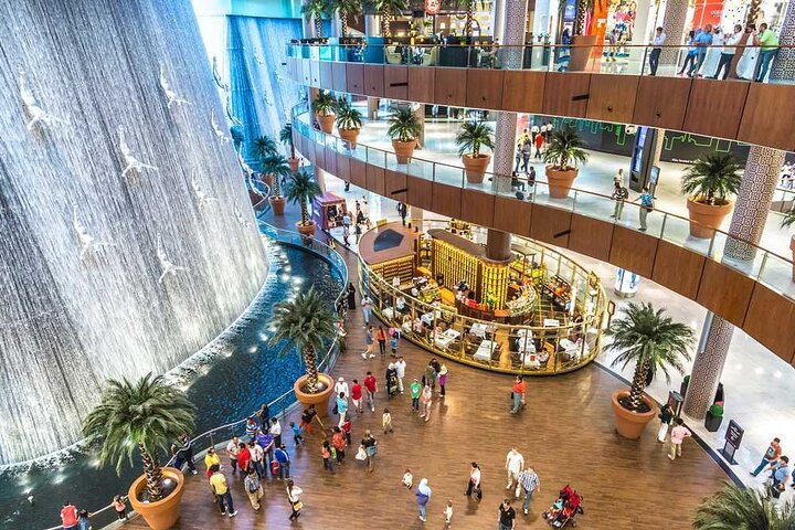 Immerse yourself in the luxury of shopping at Dubai Mall surrounded by striking architecture and a stunning waterfall before ascending to the heights of the Burj Khalifa for panoramic views.